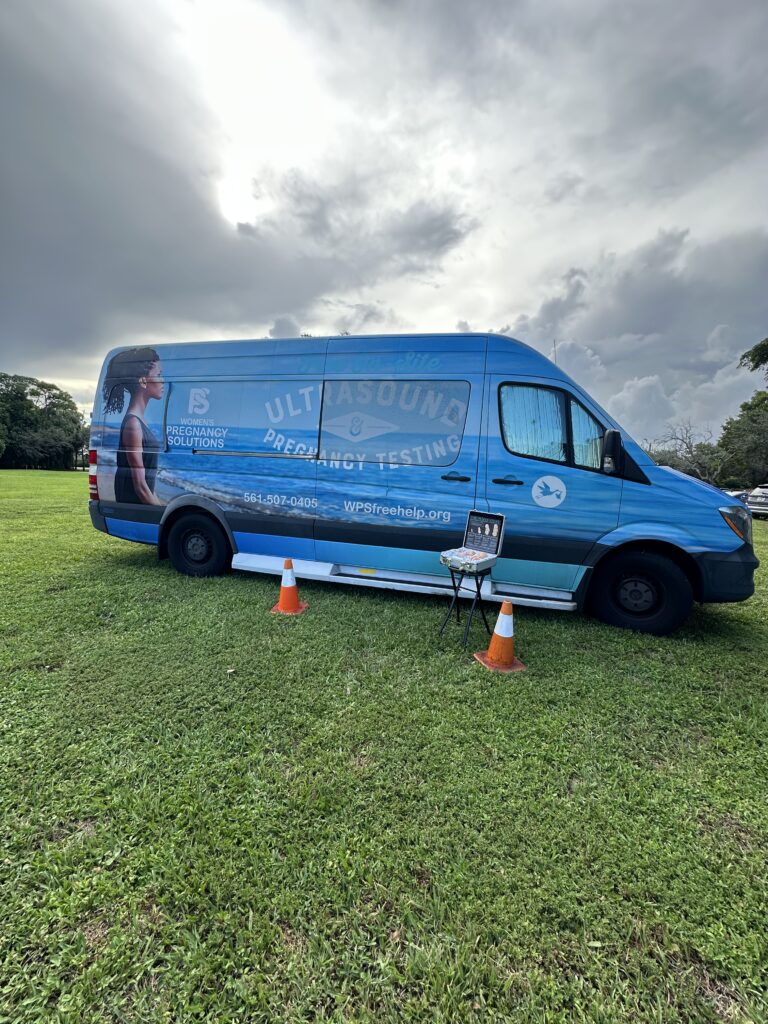 Visitors tour the Ultrasound Pregnancy Testing Van, a mobile ministry providing life-affirming care to women in need.